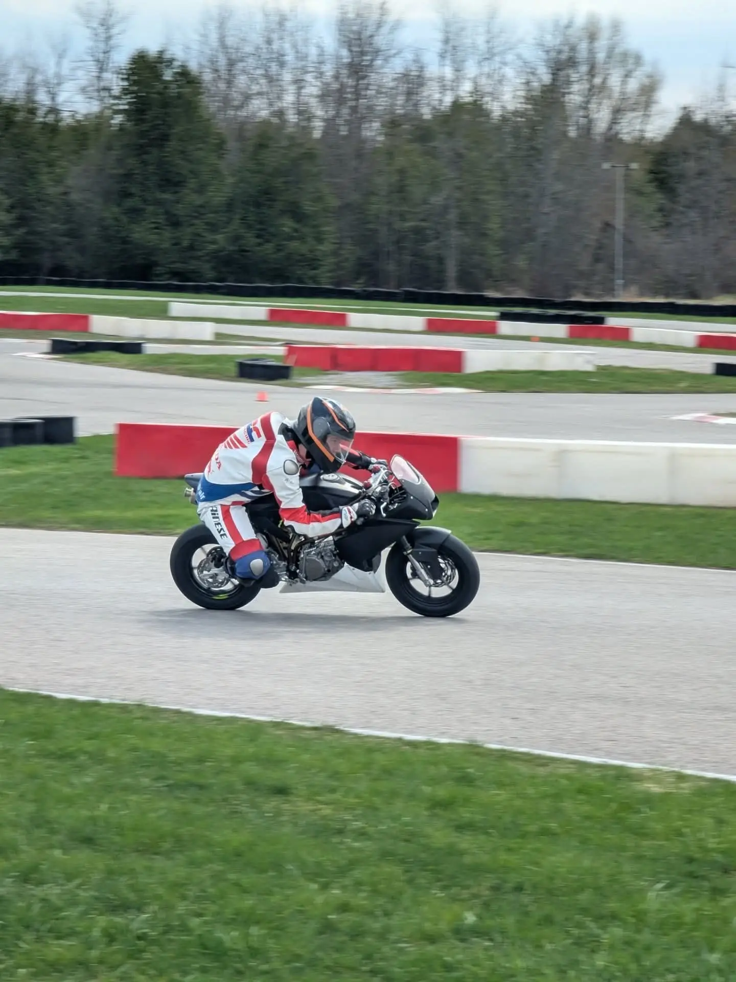 A rider on track at Brechin Motorsport Park on a cold spring day