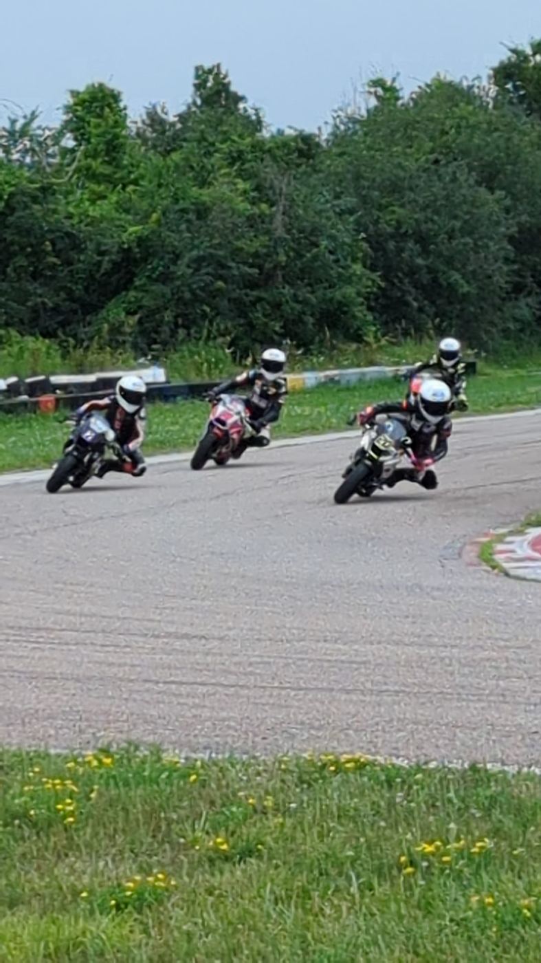 Minimoto riders running line astern at Lombardy Raceway Park