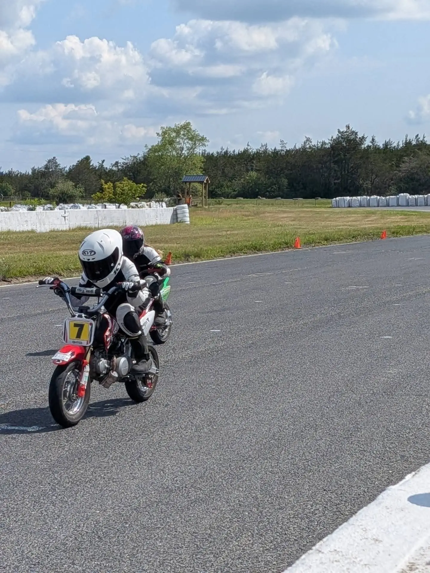 A young rider leading another on the go-kart circuit at Shannonville