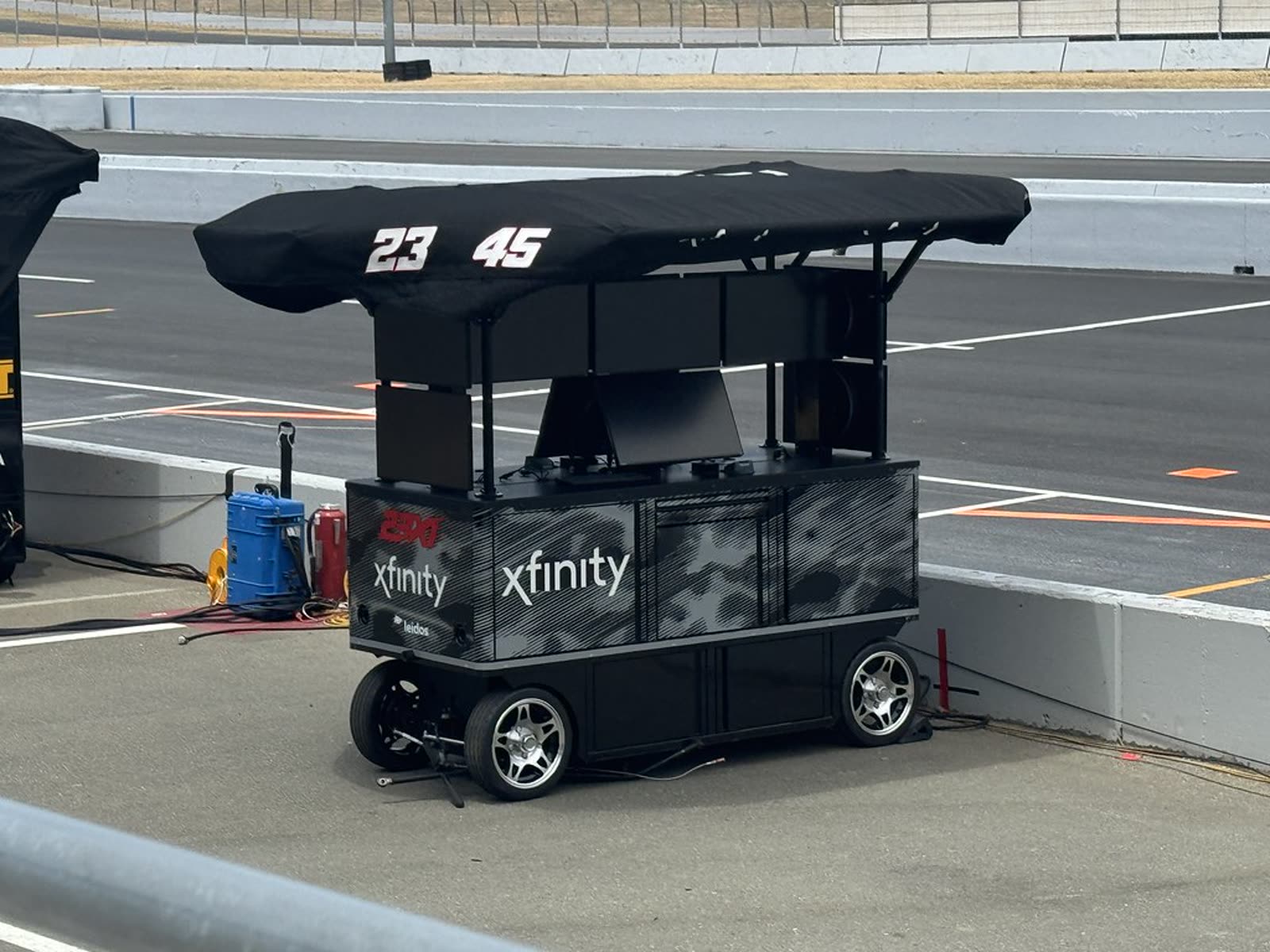 A numbered pit cart parked in a pit lane