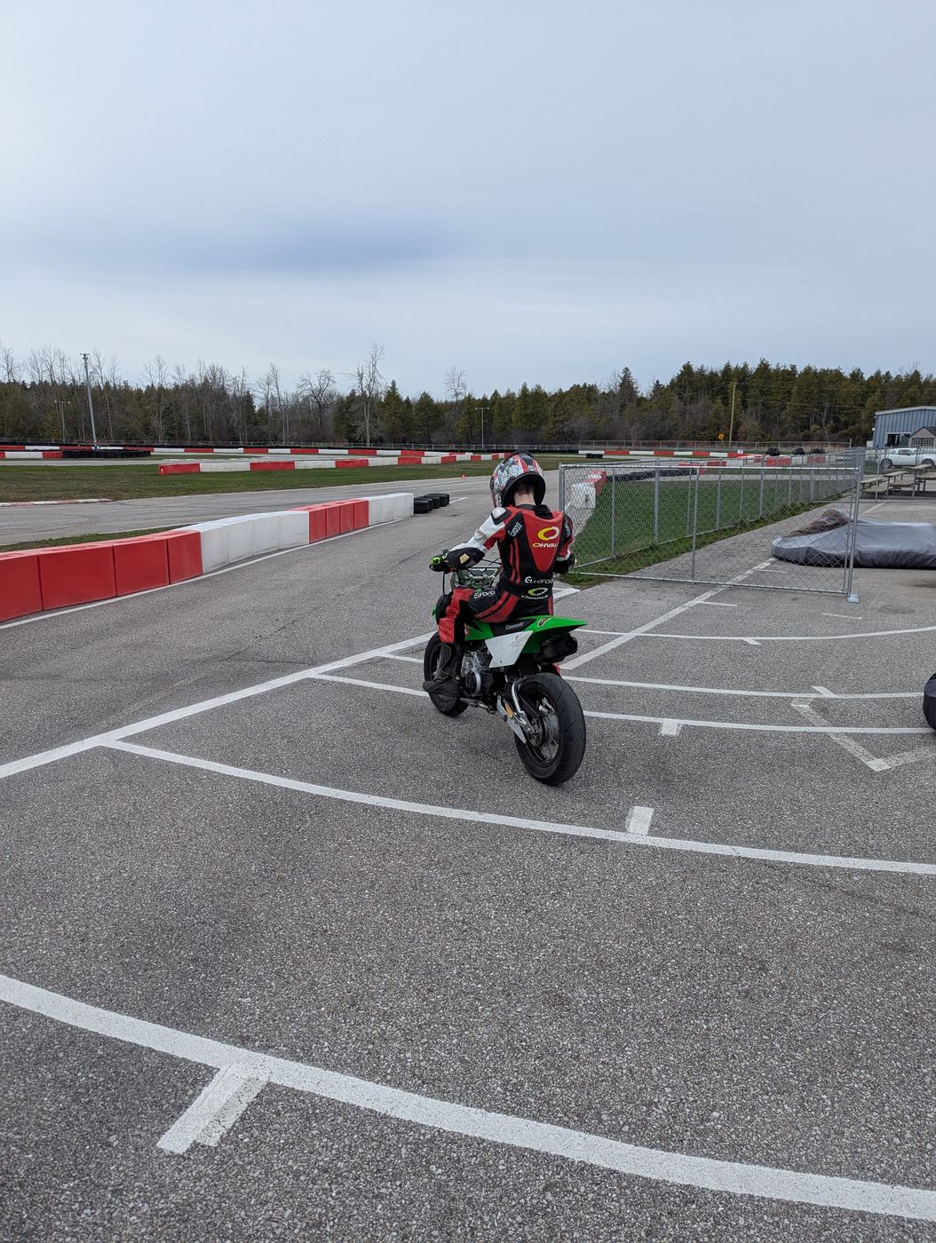 A rider bringing a minibike back through the Brechin paddock