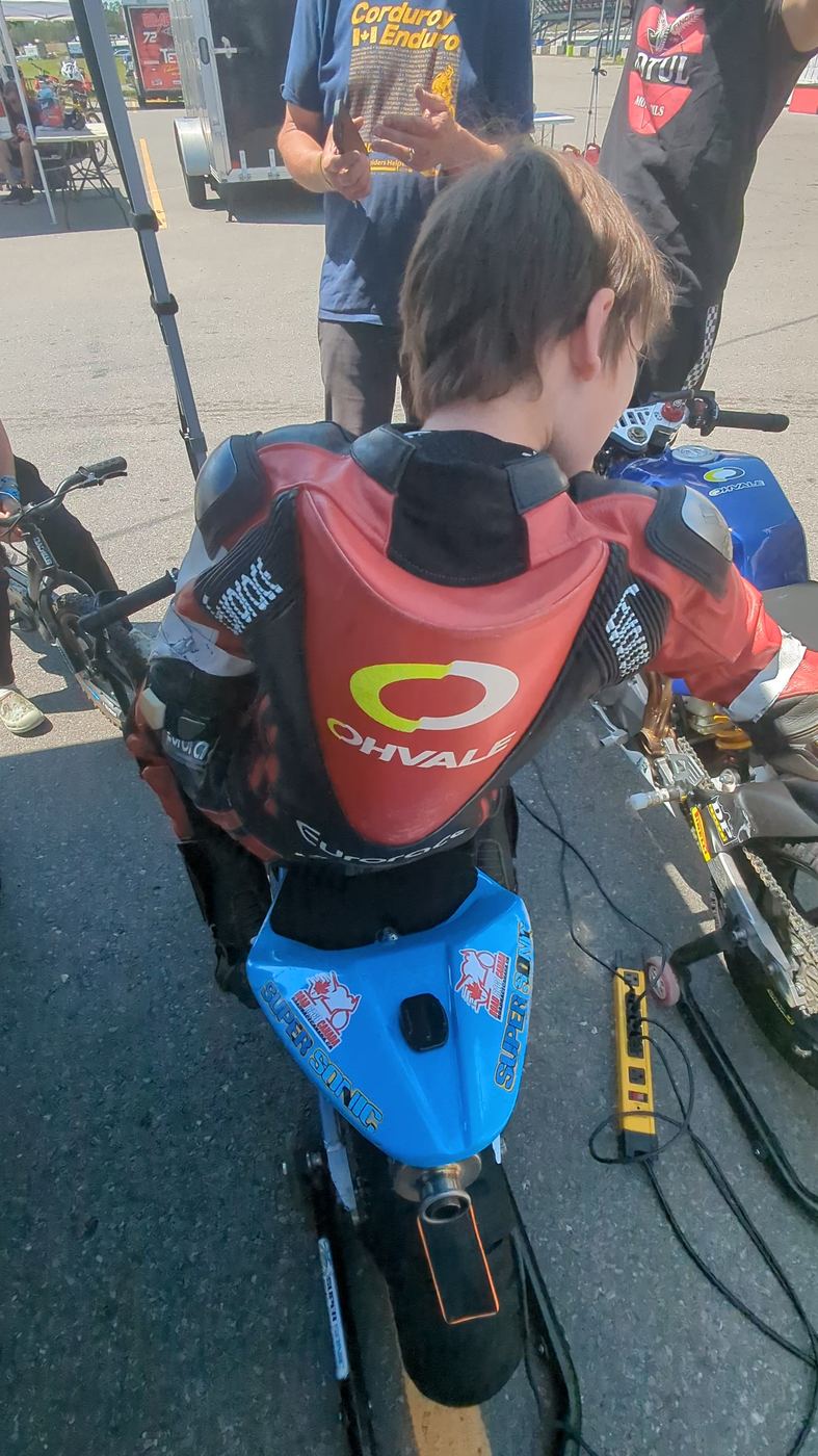 An Ohvale in the paddock with tools laid out beside it